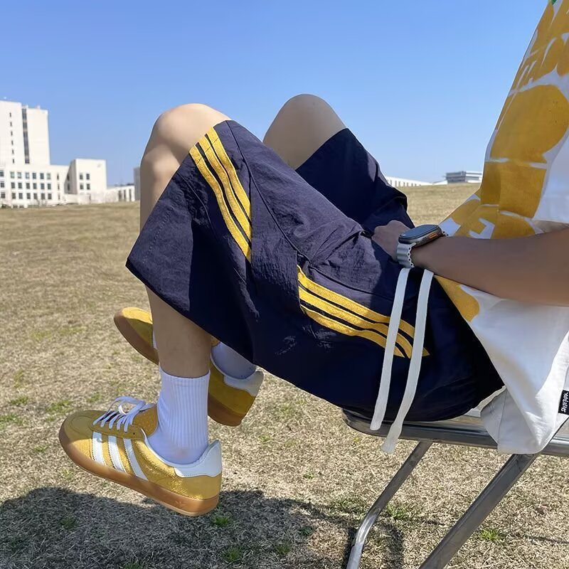 Wholesale cheap patchwork striped quick-dry basketball paratrooper shorts for boys, summer wide-leg ice silk mid-length shorts with drawstring Wholesale cheap patchwork striped quick-dry basketball paratrooper shorts for boys, summer wide-leg ice silk mid-length shorts with drawstring