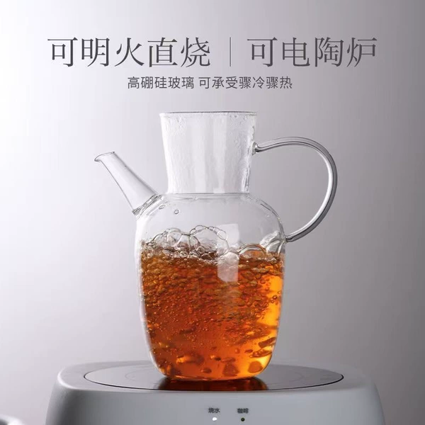 Glossy water-filled green teapot