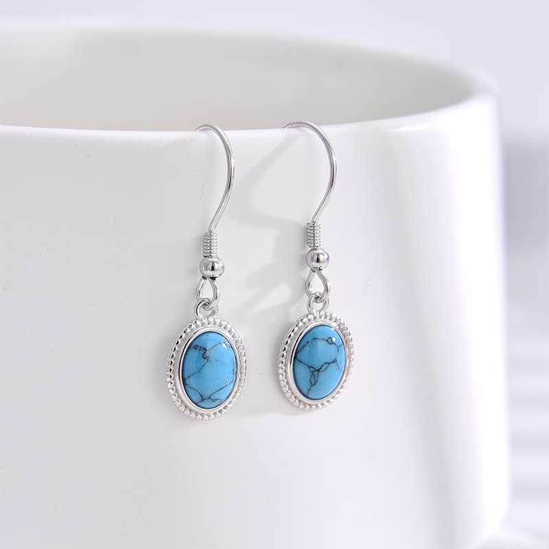 S925 plata esterlina turquesa pendientes nicho femenino retro Europa y América de moda ligera lujosa atmósfera alta sensación pendientes de orejas