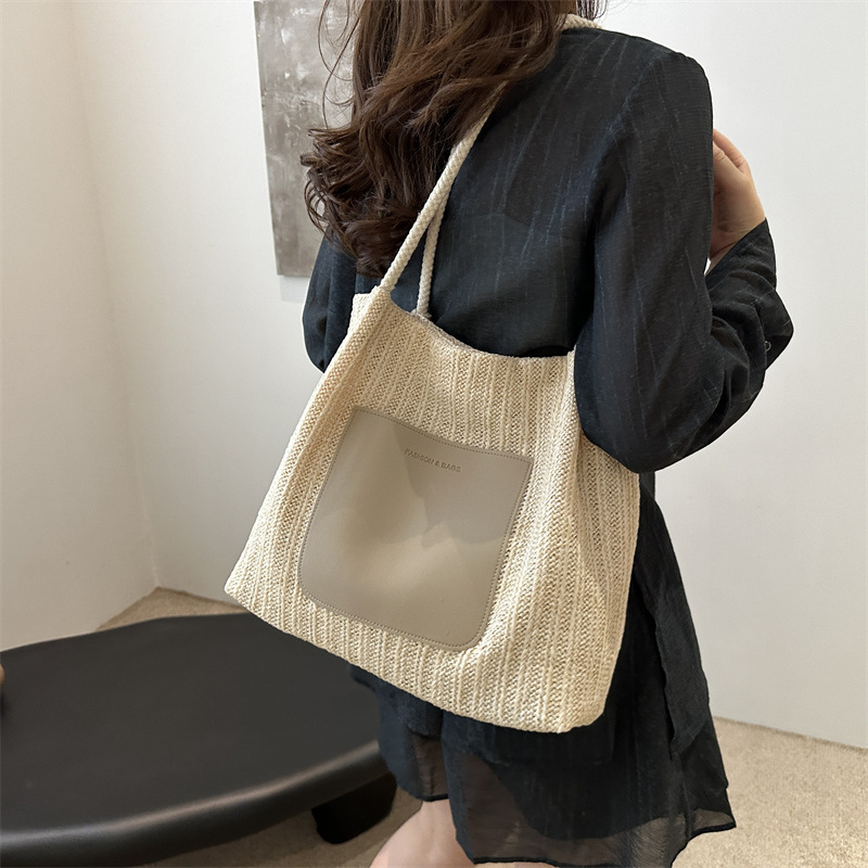 Bolsa de tejido de gran capacidad para mujeres 2024 nueva moda bolso de hombro de aire extranjero de alta calidad sensación de tela de paja bolso de mujer bolso especial