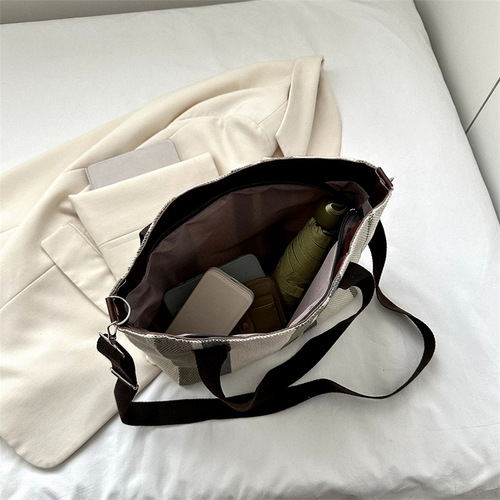 Trendy large-capacity striped canvas bag for women  new fashion commuter handheld tote bag single shoulder crossbody bag