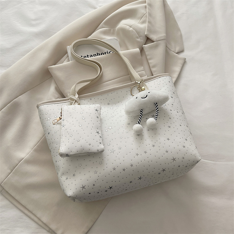 2026 primavera nueva bolsa de hombro de gran capacidad bolsa de brazo universal tendencia transfronteriza dulce viento bolso de mano bolso de mujer
