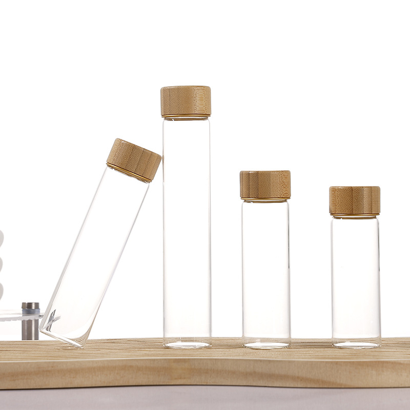 Botella de reactivo de la píldora de muestra de tapa de madera de bambú al por mayor, botella de embalaje de azafrán de boca de tornillo, botella de control de borosilicato de 30mm de diámetro