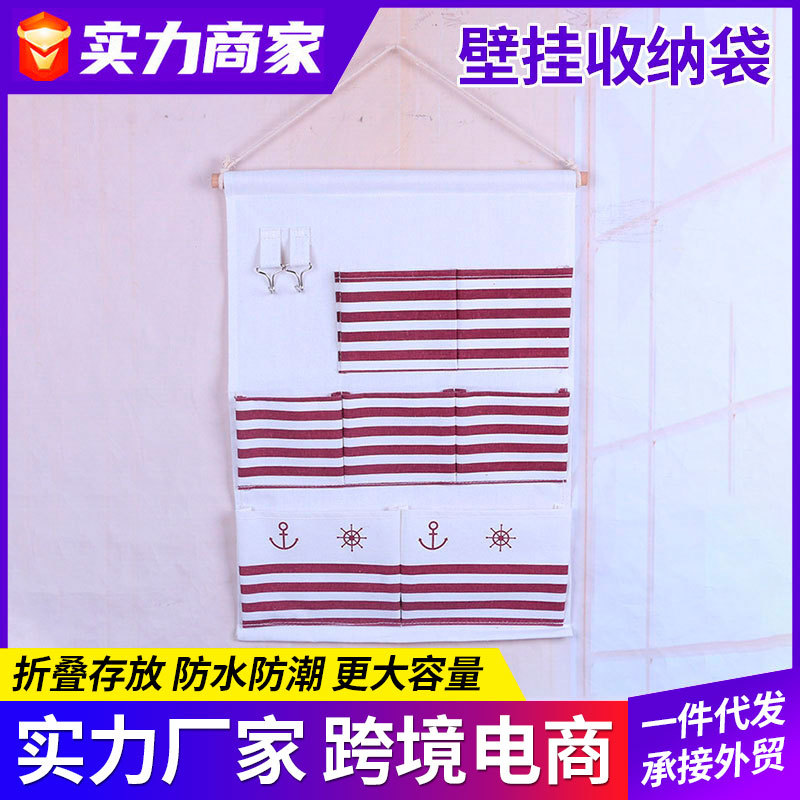 Comercio exterior algodón y lino 8 bolsillos bolsa colgante de almacenamiento de rayas bolsa de almacenamiento de baño bolsa de almacenamiento de pared botón colgante bolsa fabricante