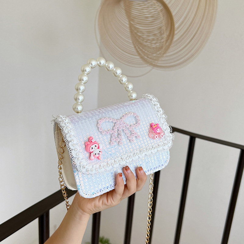 2025 nuevo lindo arco princesa bolsa de perlas portátil moda versátil mochila de hombro bolso de cambio coreano