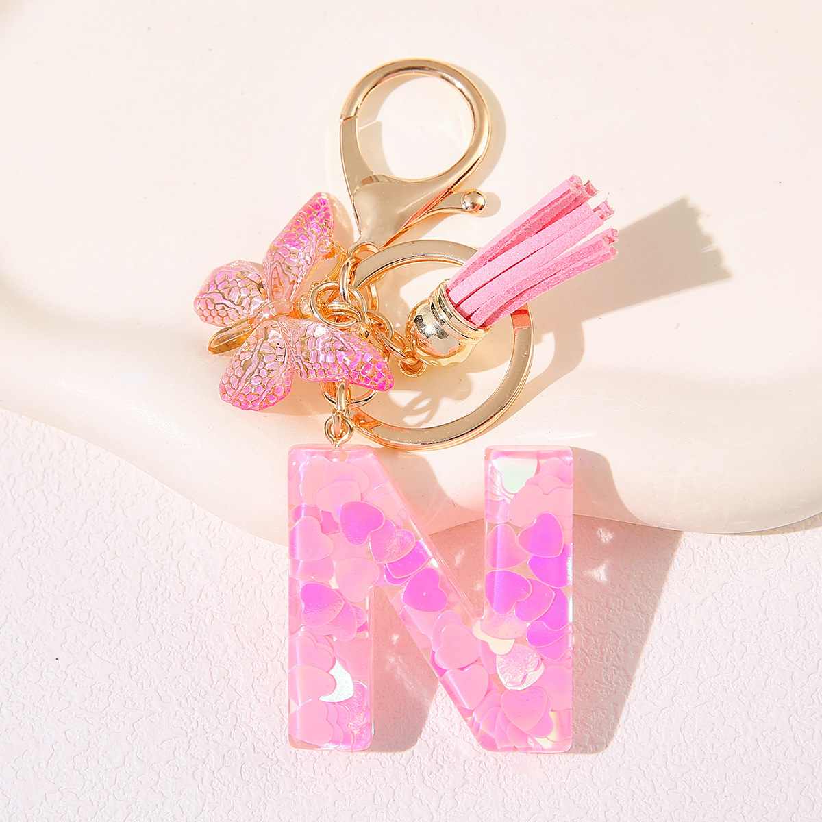 Nuevo rosa damas letras A-Z llavero de goteo de goma sequilla amor letras bordas mariposa llavero transfronterizo