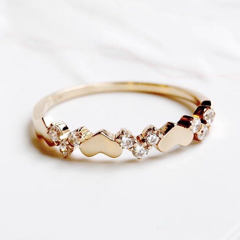 Golden ring with zircon heart shaped for St. Valentine's Day