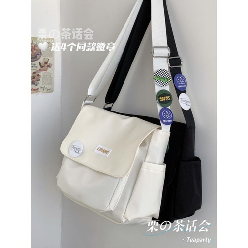 Tea party style Japanese INS Hong Kong style versatile artistic streetwear unisex postman shoulder bag for men trendy student crossbody bag for women