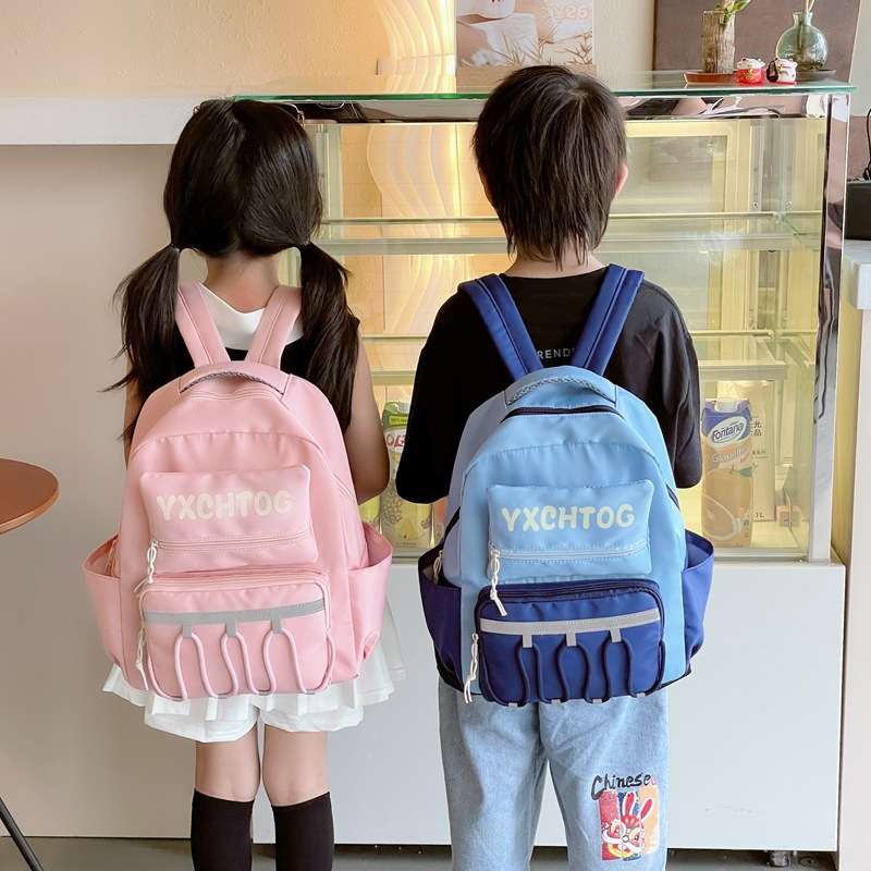 Mochila escolar coreana para niños y estudiantes con letras de color contrastante personales para reducir la carga de la mochila de jardín de infantes de gran capacidad