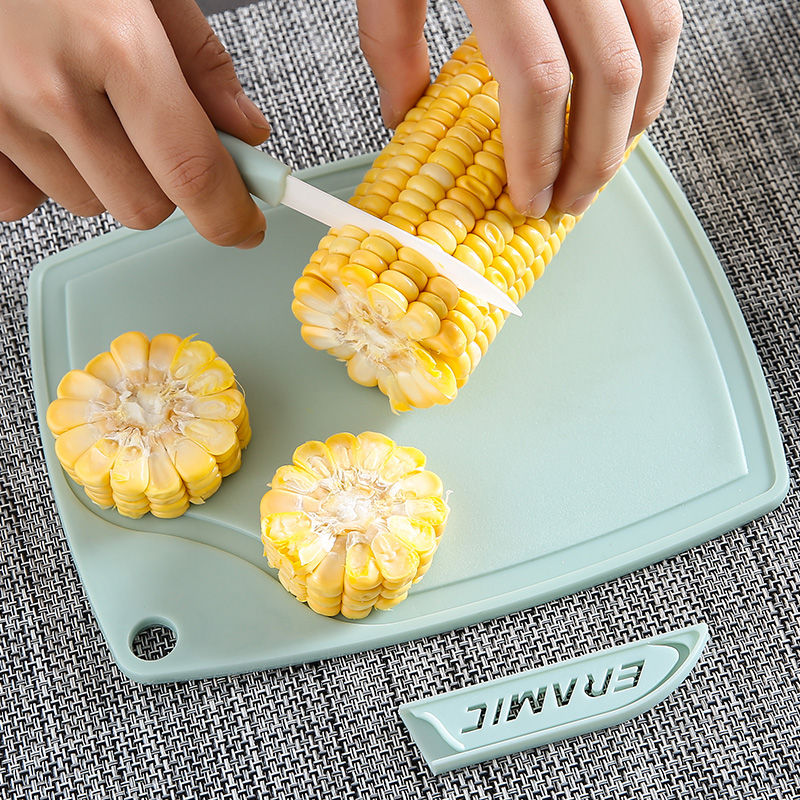 Ceramic fruit peeler, vegetable cutting board, and chopping block set for home kitchen, featuring a ceramic peeler, small knife