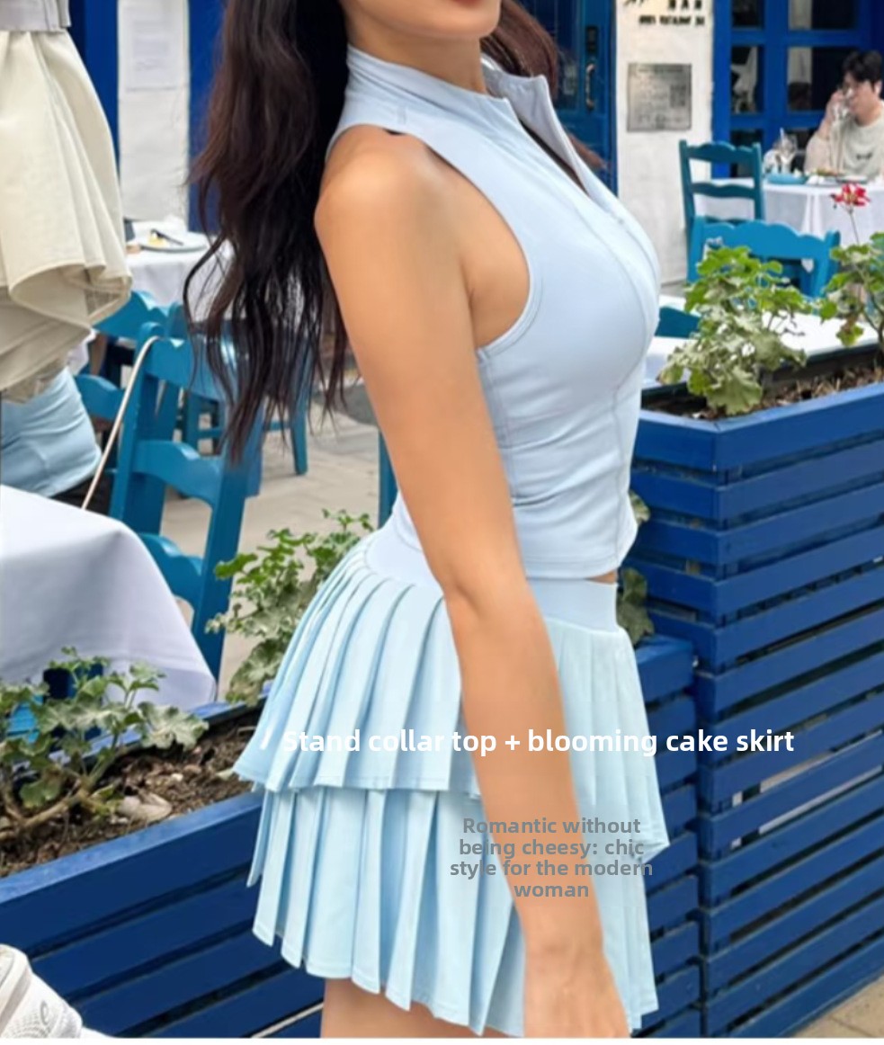 Women's sleeveless zip tennis top and double-layer pleated skirt detail