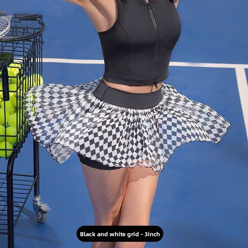 Women's sleeveless polo tennis top and checkered skirt detail