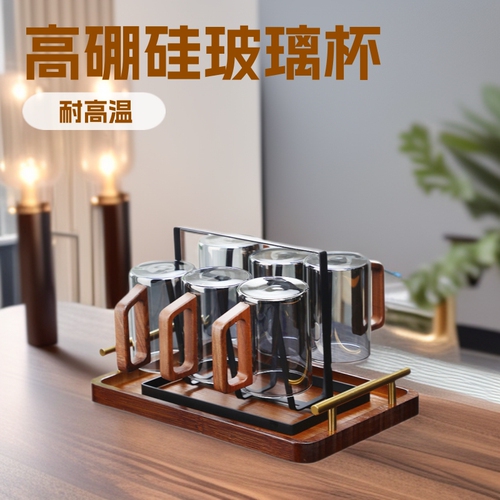 Cross-border wooden-handle glass tea cups, heat-resistant living room cups, and home-use hospitality water set—including a kettle and matching water glasses.