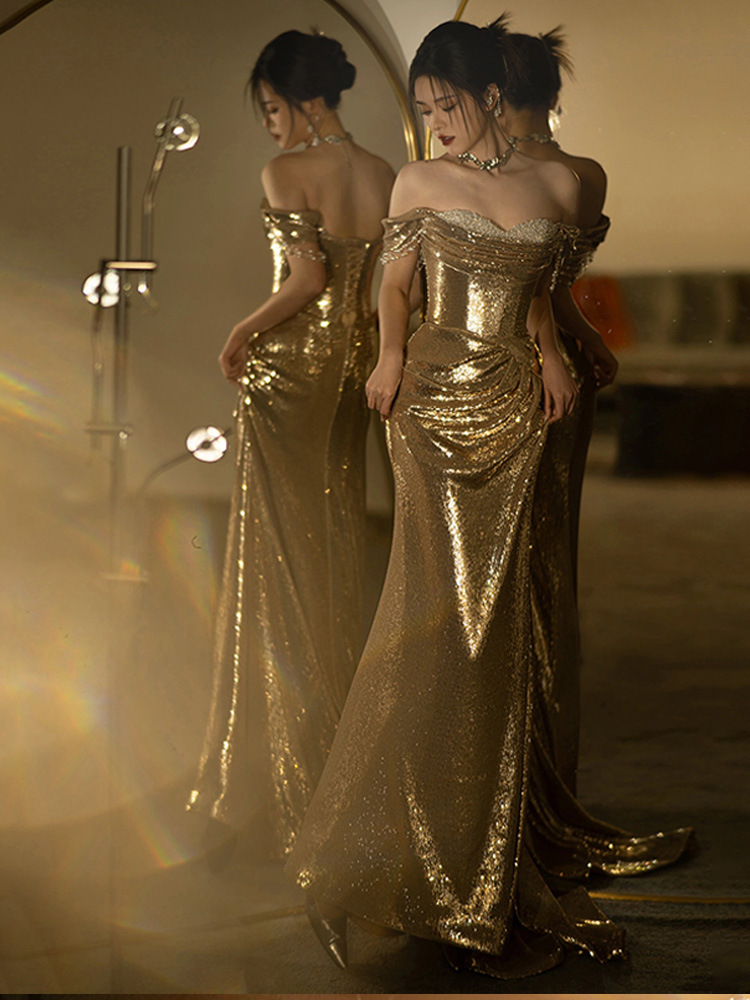 Robe de soirée sirène élégante à sequins dorés, épaules dénudées, idéale pour un mariage, un banquet, une réception ou un bal de débutantes._voghion.com